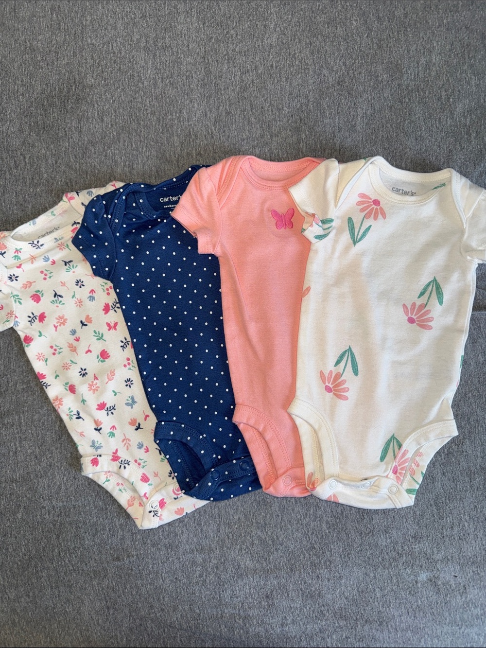 Carter's Girls 4-Pack Short-Sleeve Onesies – Pink, Navy, White, Floral